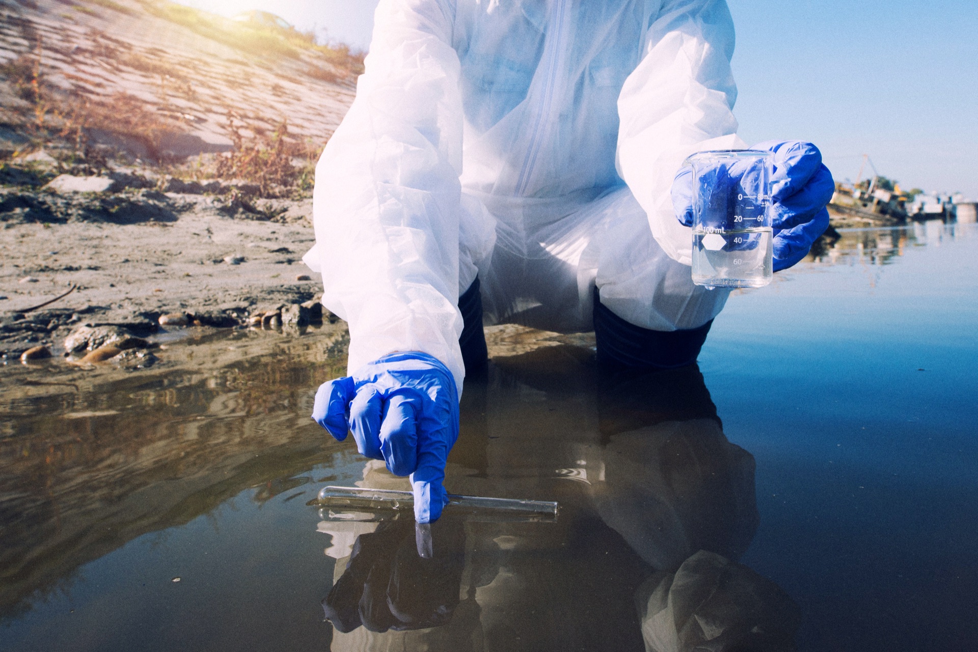 Researcher collecting a water sample