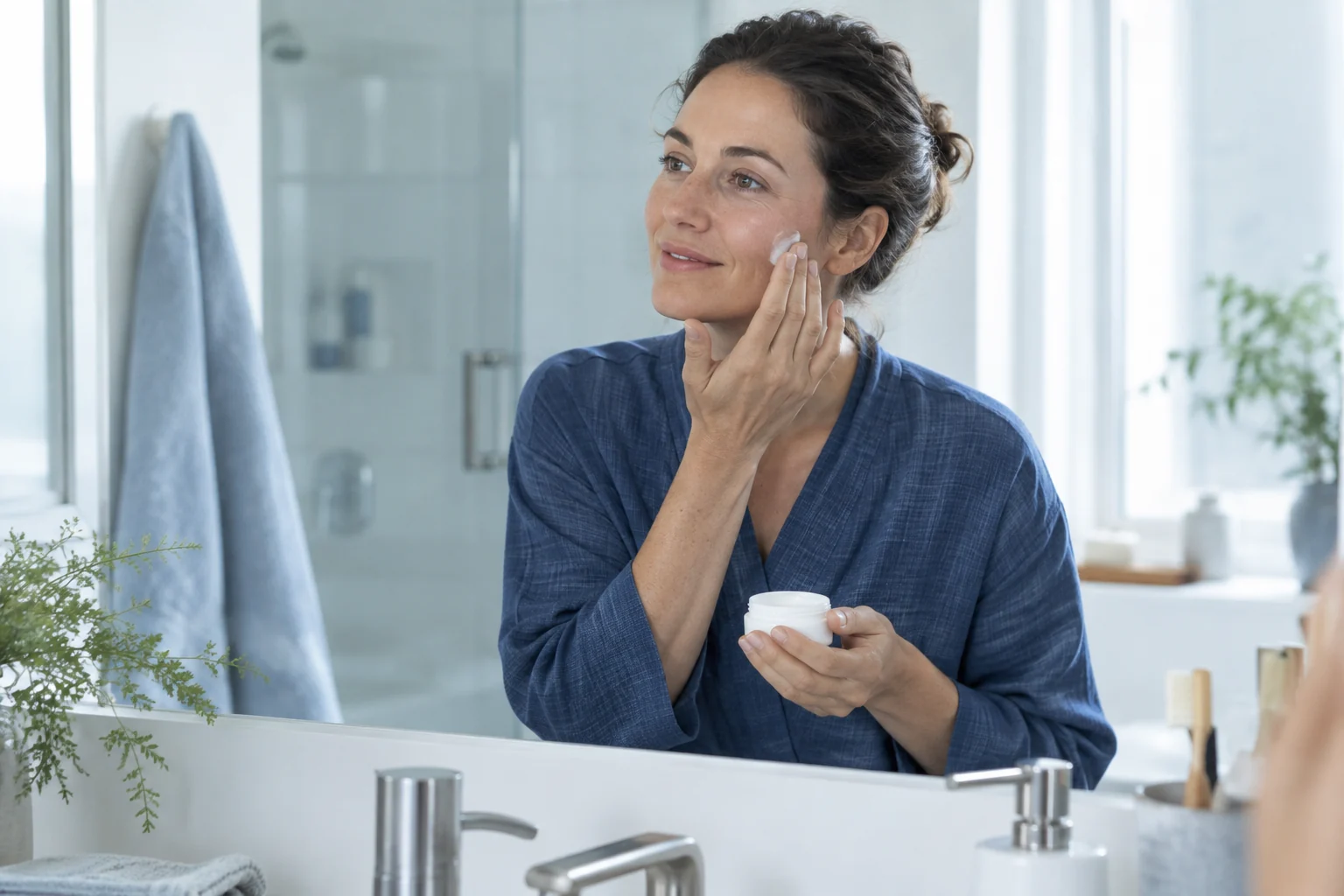 A woman applying unbranded skincare in her daily routine