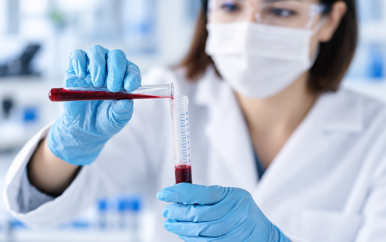 Laboratory researcher transferring a sample without decorative overlays